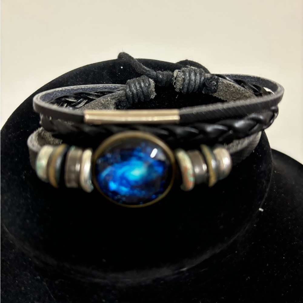 This beautiful galaxy blue planet bracelet could be unisex .